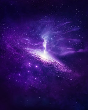 A stunning and vibrant depiction of a galaxy with a concentrated burst of bright white light at its center, surrounded by swirling, rich shades of purple and blue. The cosmic scene is filled with countless tiny stars scattered throughout the dark expanse of space, creating a mystical and awe-inspiring celestial atmosphere.