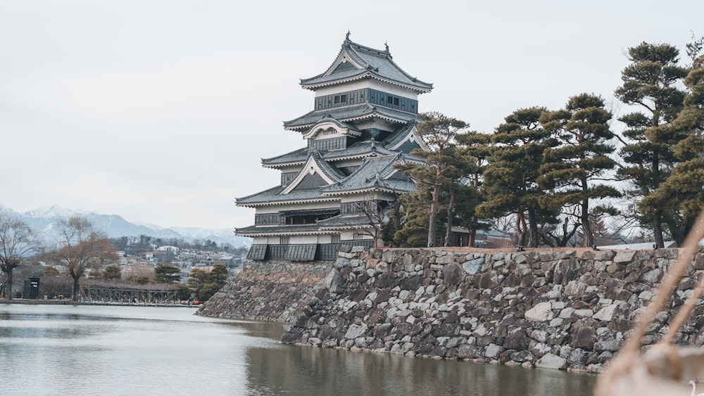 a tall building next to a body of water