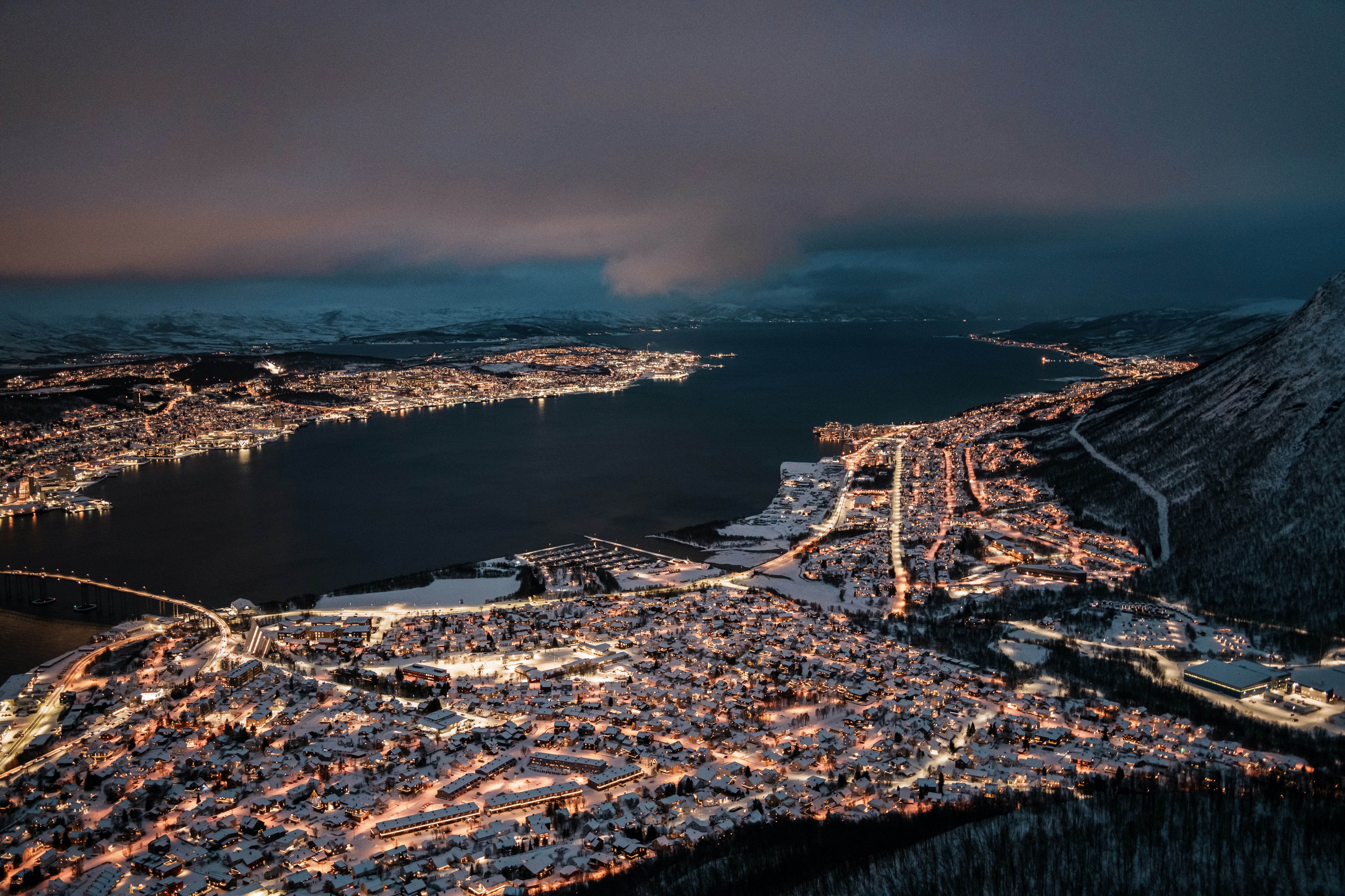 an aerial view of a city at night