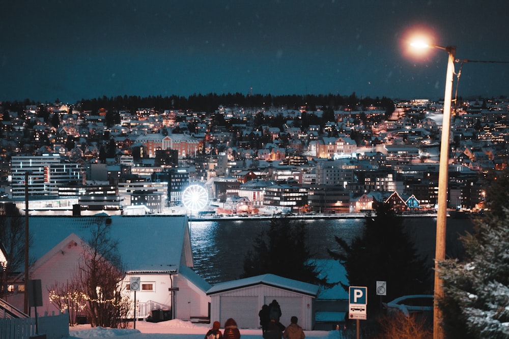 a group of people walking down a snow covered hill