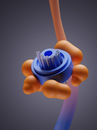 A futuristic and abstract 3D rendering featuring a central blue cylindrical object with several tube-like protrusions surrounded by orange, cloud-like structures. These elements are set against a gradient gray background with a twisting, textured ribbon that transitions from orange to purple.