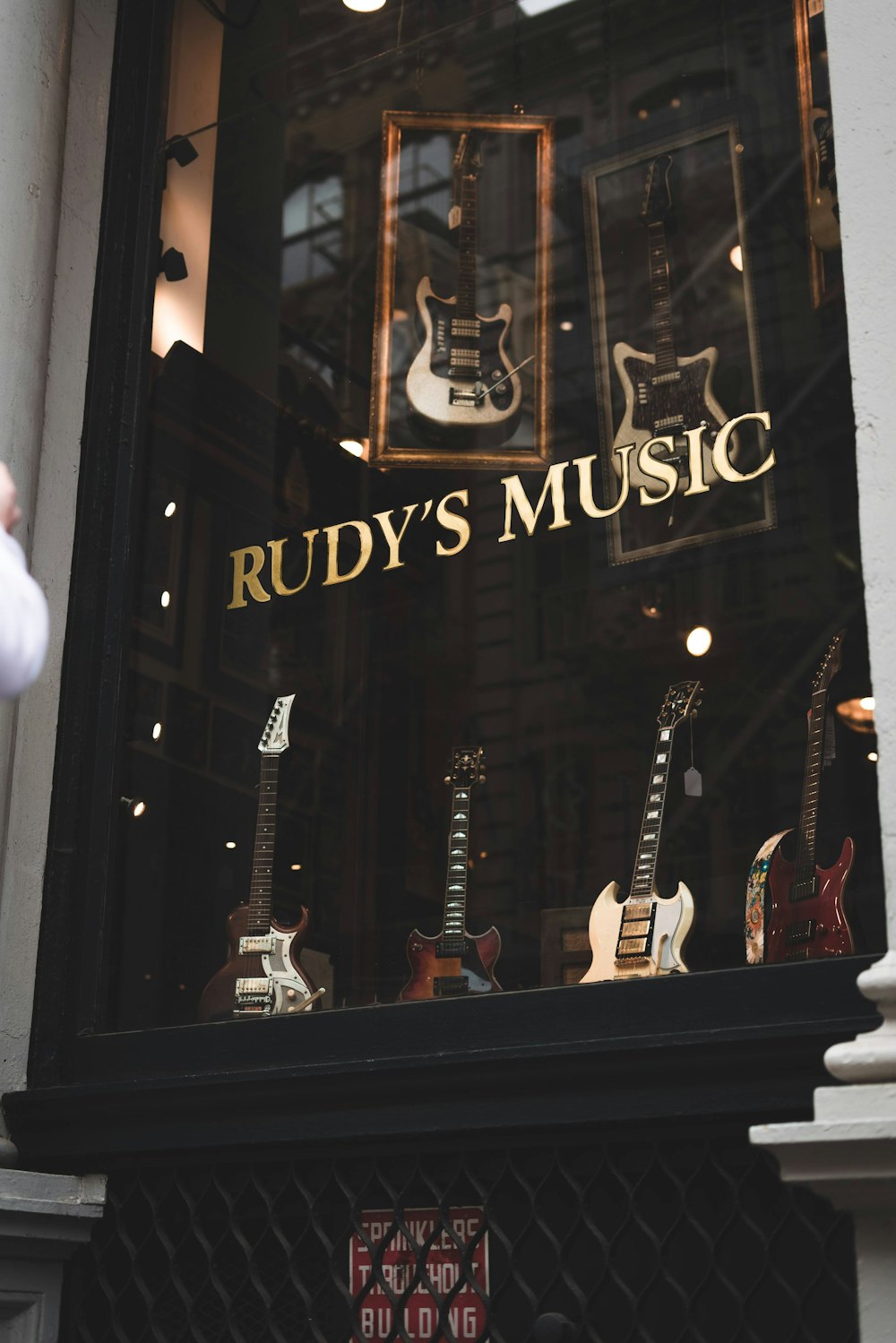 a store window with guitars and guitars in it