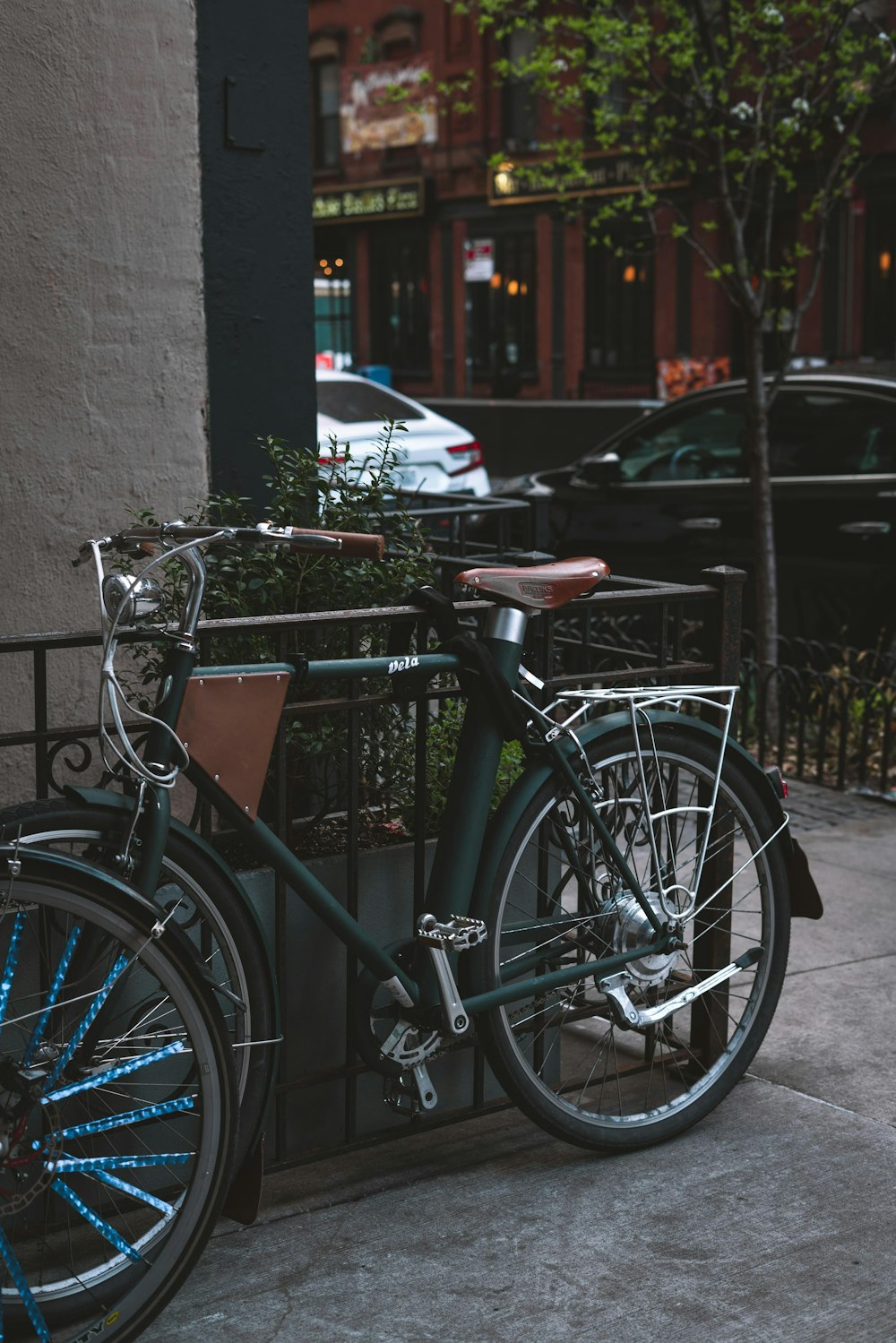 a bicycle parked on the side of the street