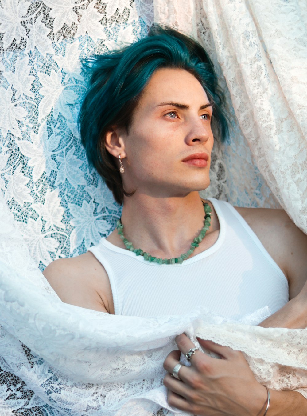 a woman with blue hair is laying down
