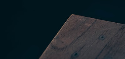 A close-up of premium wood grain on a contemporary dining table from our collection.