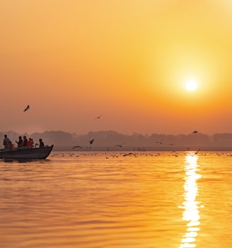 a group of people on a boat in the water