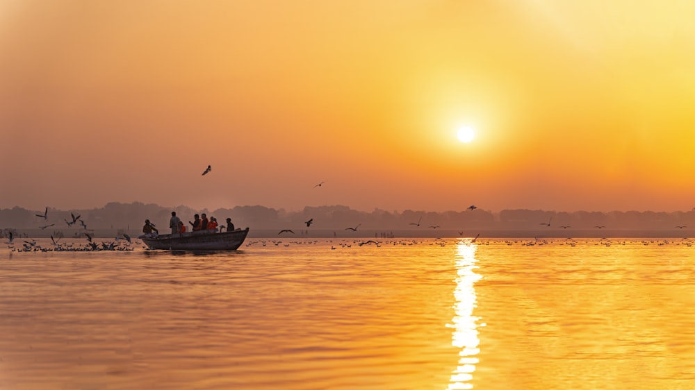 a group of people on a boat in the water