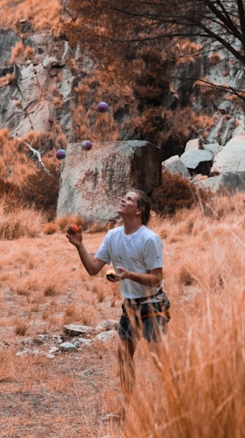 Jugglers tossing colorful balls during an outdoor event