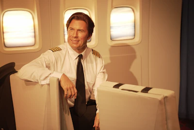 A pilot receiving one-on-one coaching in a bright, professional office setting.