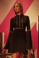 A chic women's dress displayed on a mannequin.