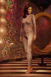 User interface of a virtual fitting room with upload button and product showcase.