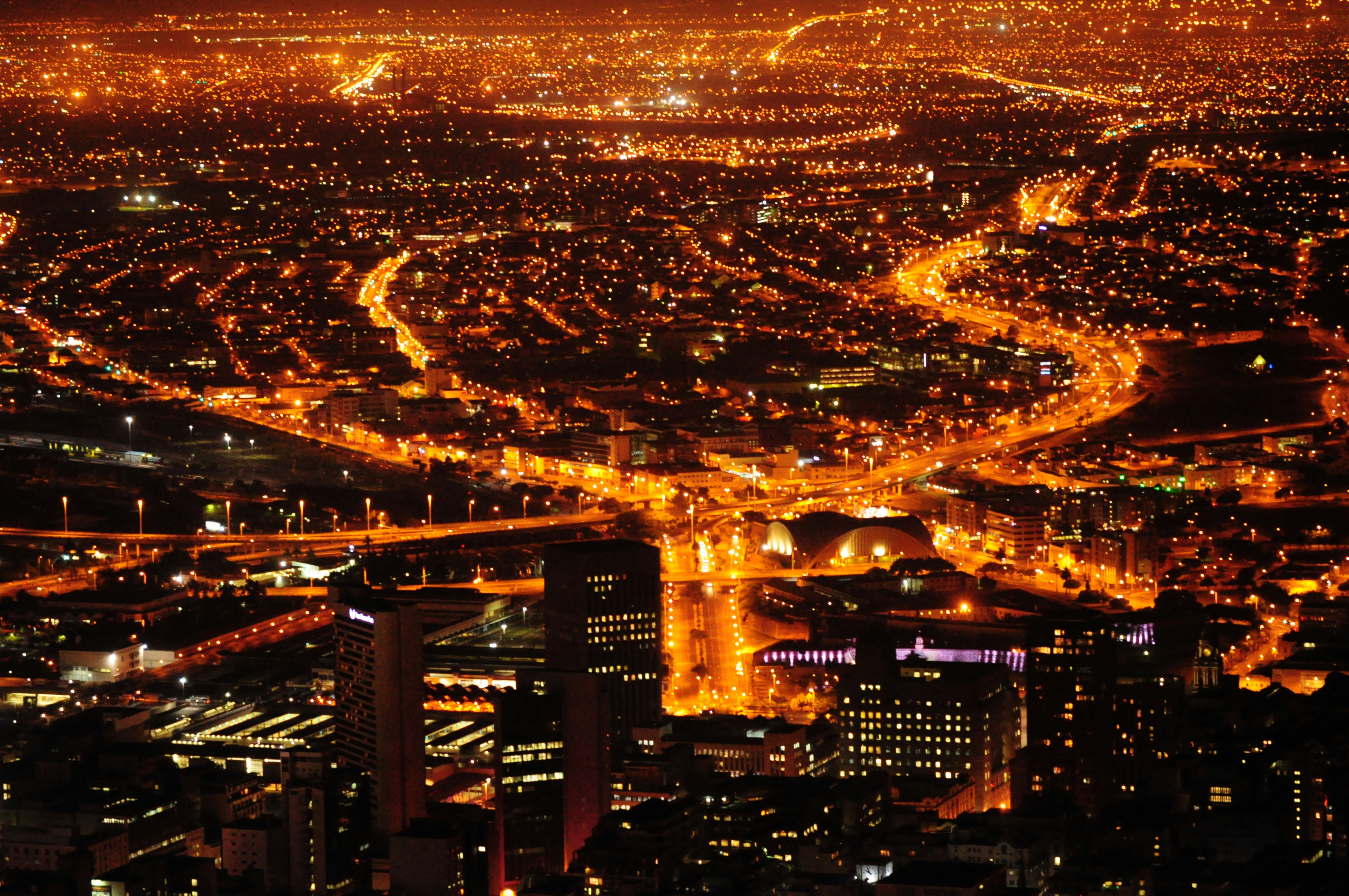 an aerial view of a city at night
