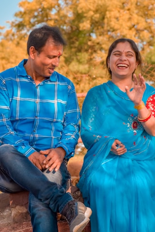 a man and a woman sitting next to each other