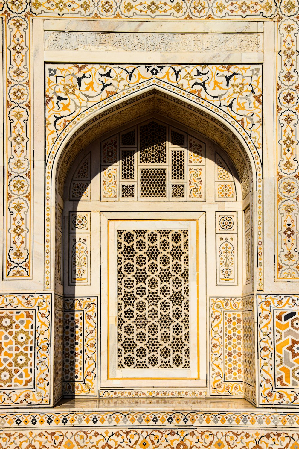 a close up of an arch with a clock on it