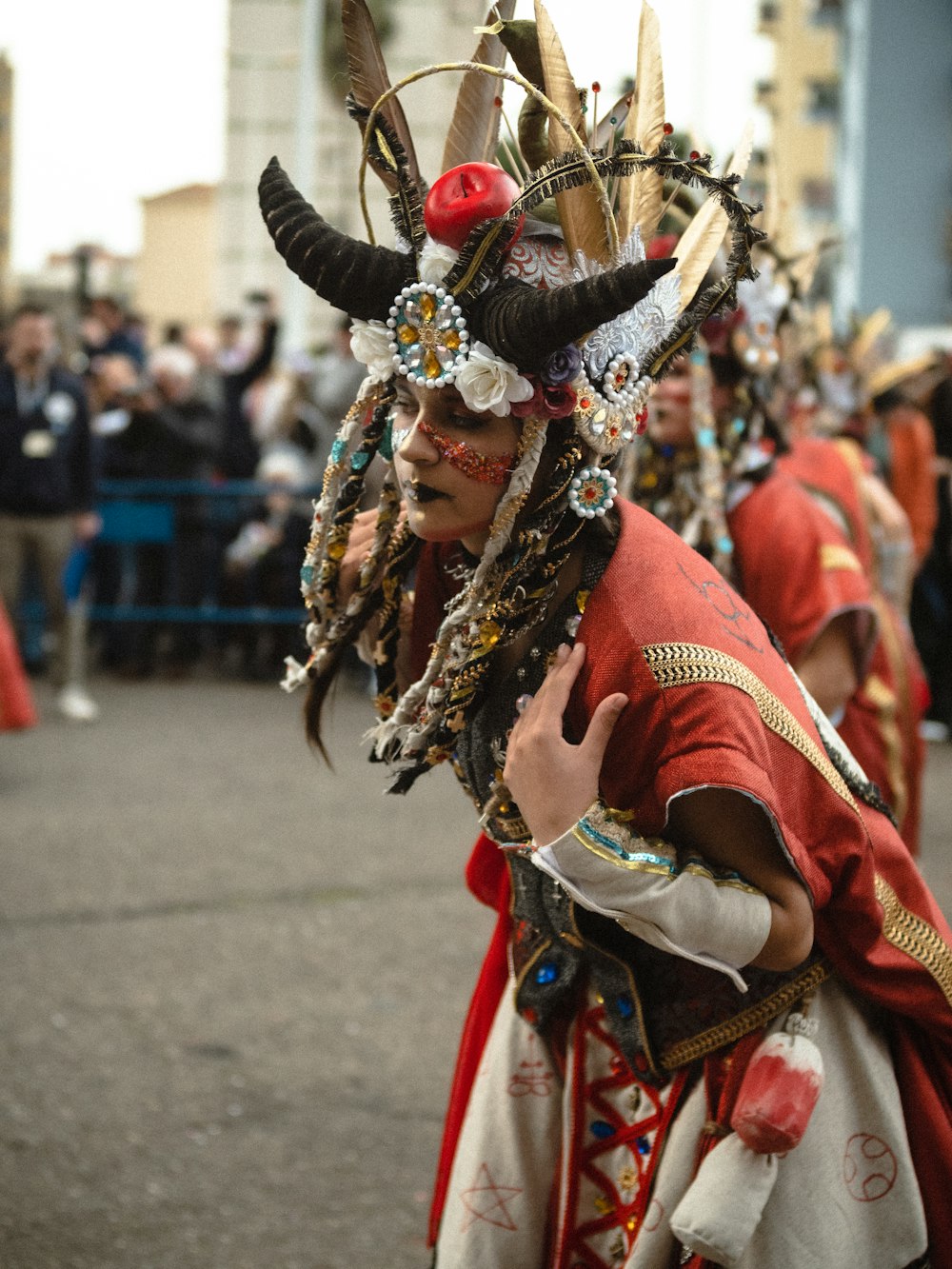 a man in a costume is walking down the street