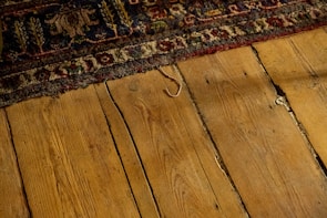 A washable rug with subtle patterns laid out in a cozy living space.