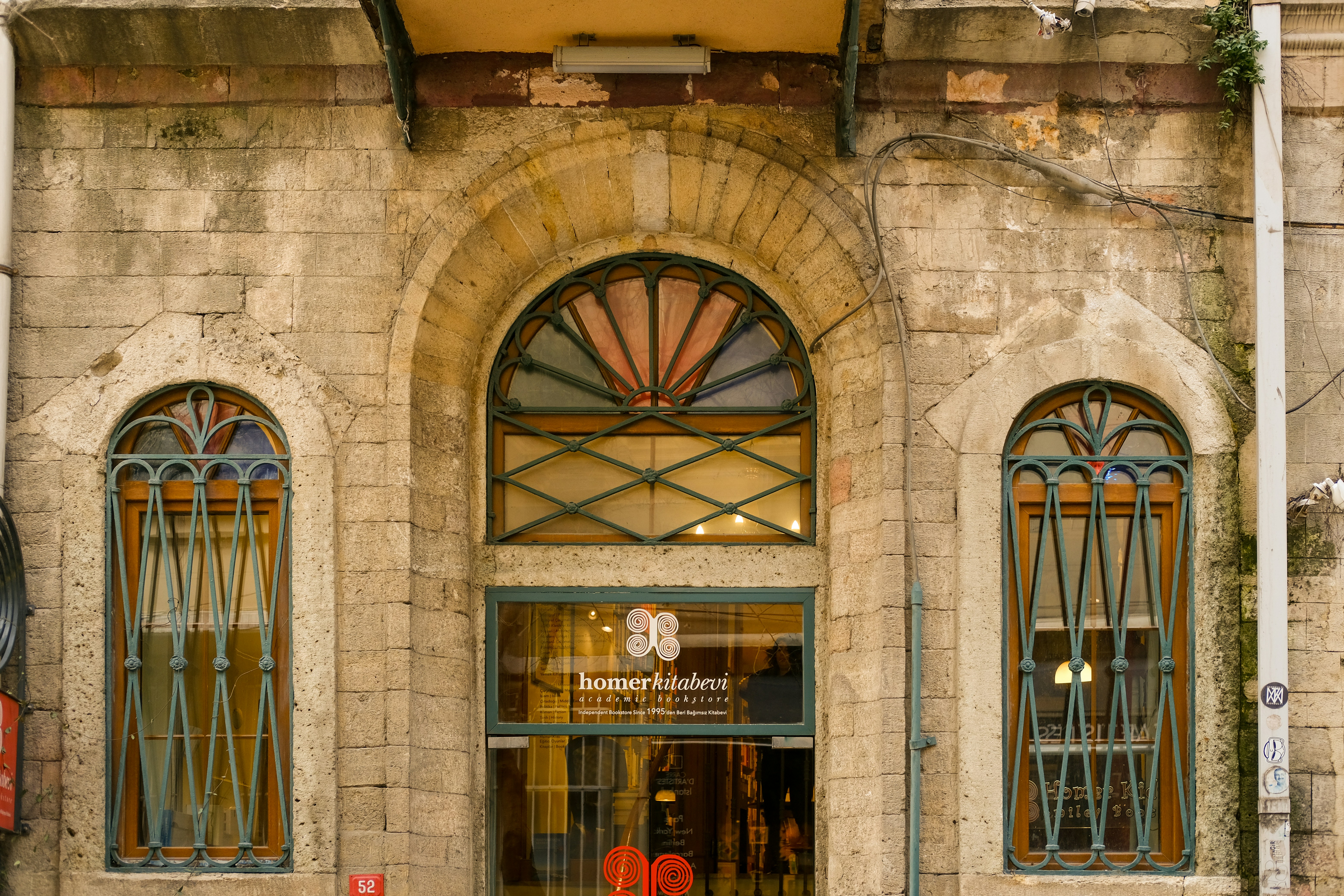 an old building with a clock on the front of it