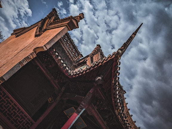 A cinematic wide-angle shot of a freshly completed modern roof under a dramatic sky.