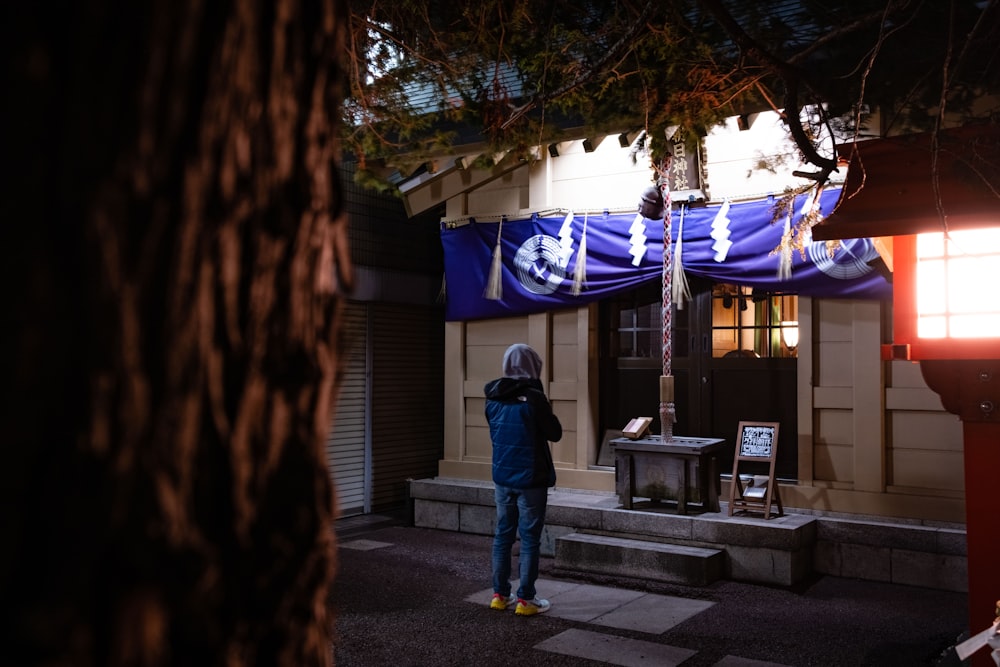 a person standing in front of a building