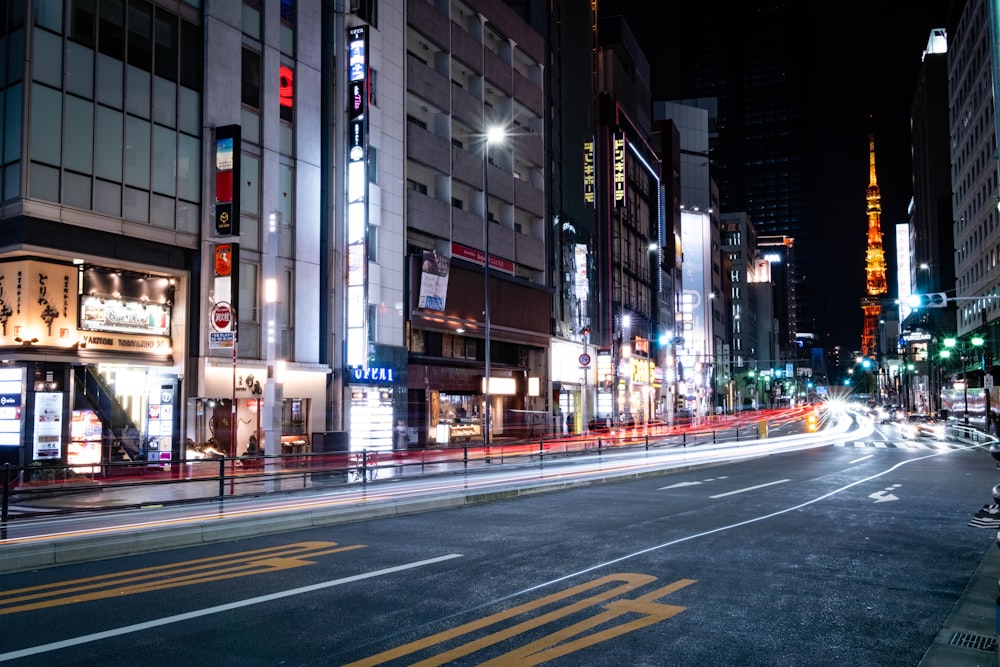 a city street at night with traffic lights