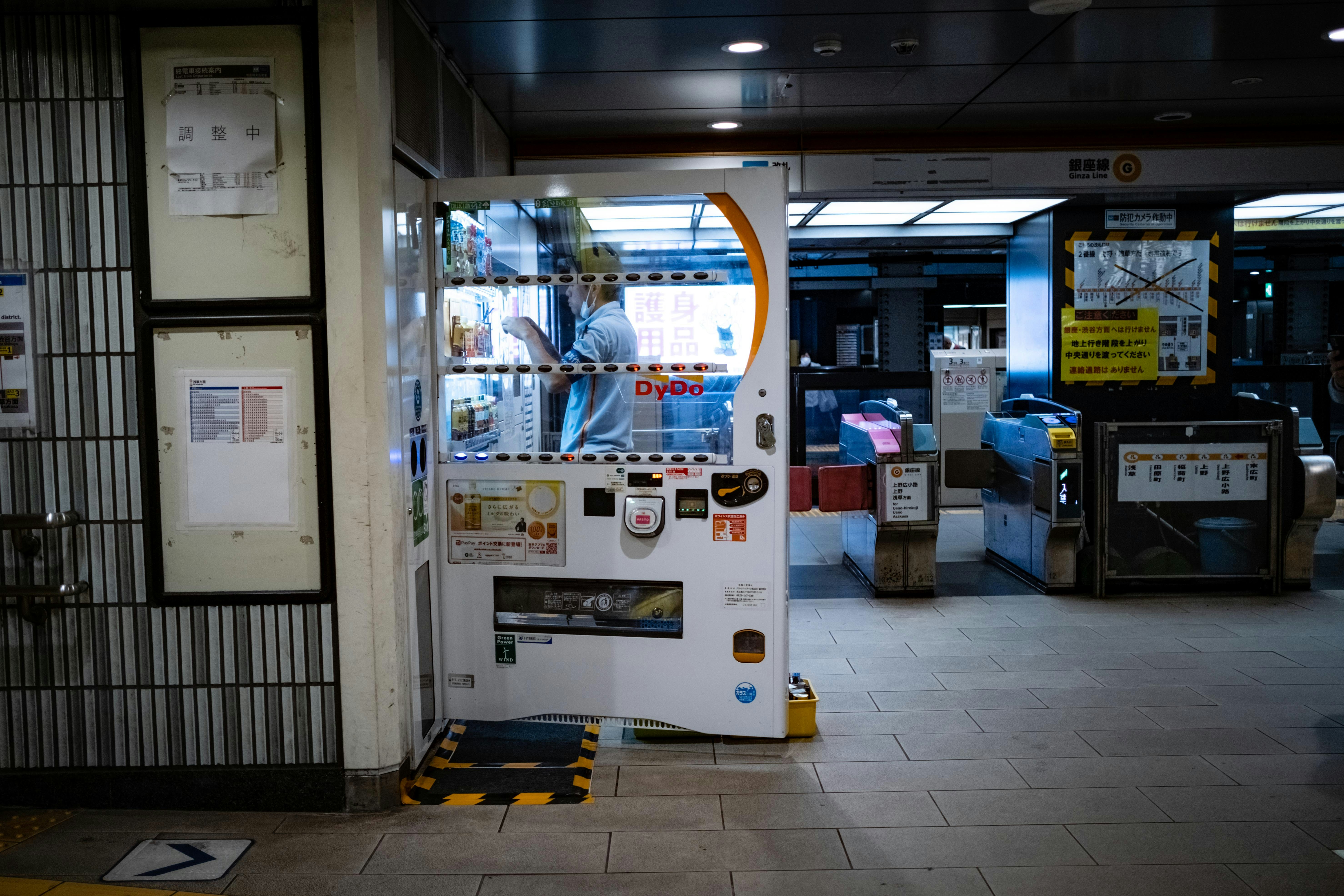 Exterior of a modern auto repair shop with an electric vehicle parked out front