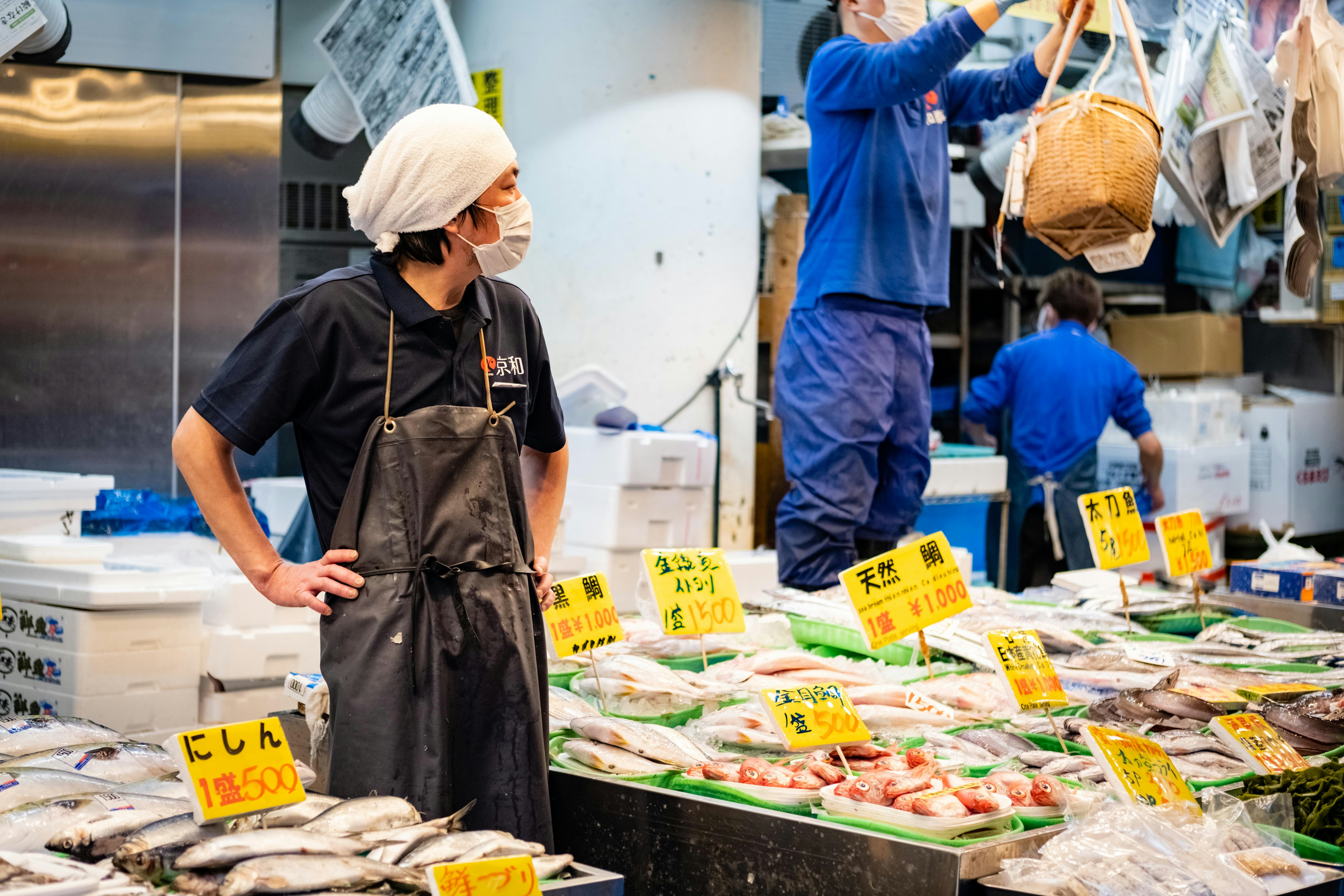 sushi chef hands preparing nigiri Tokyo restaurant
