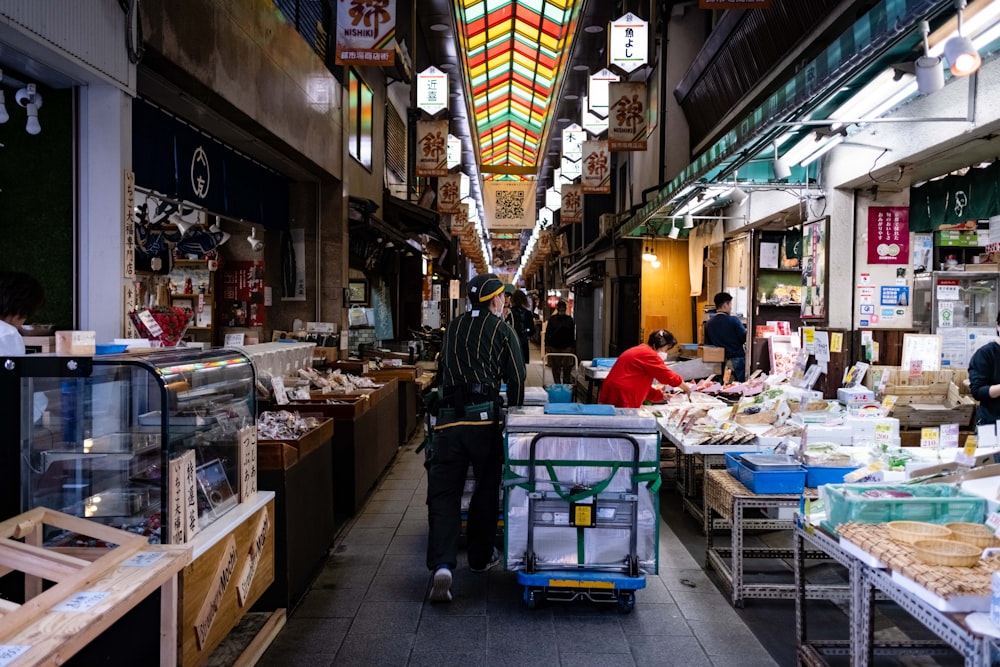 a man pushing a cart through a market