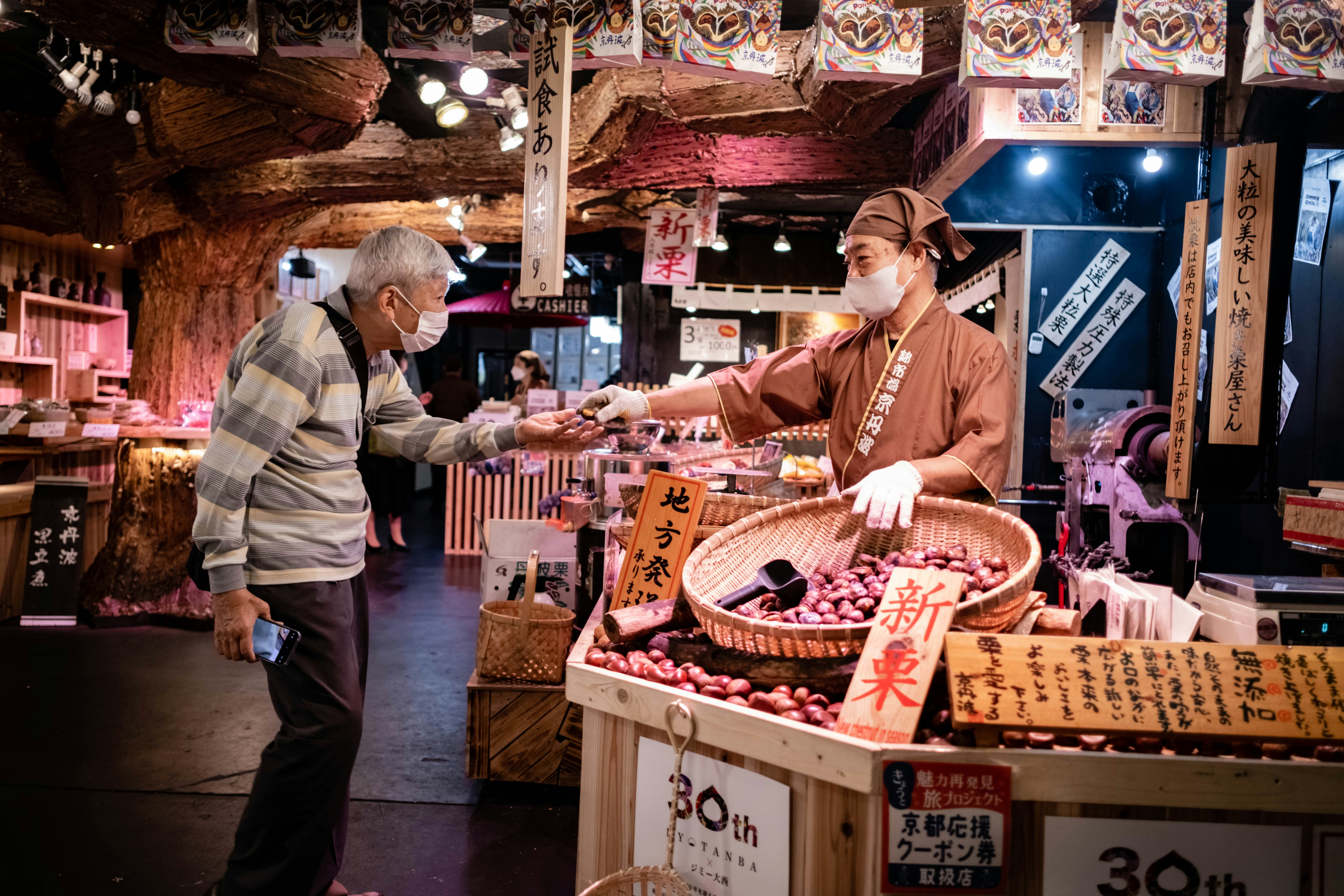 a man standing next to another man in a store