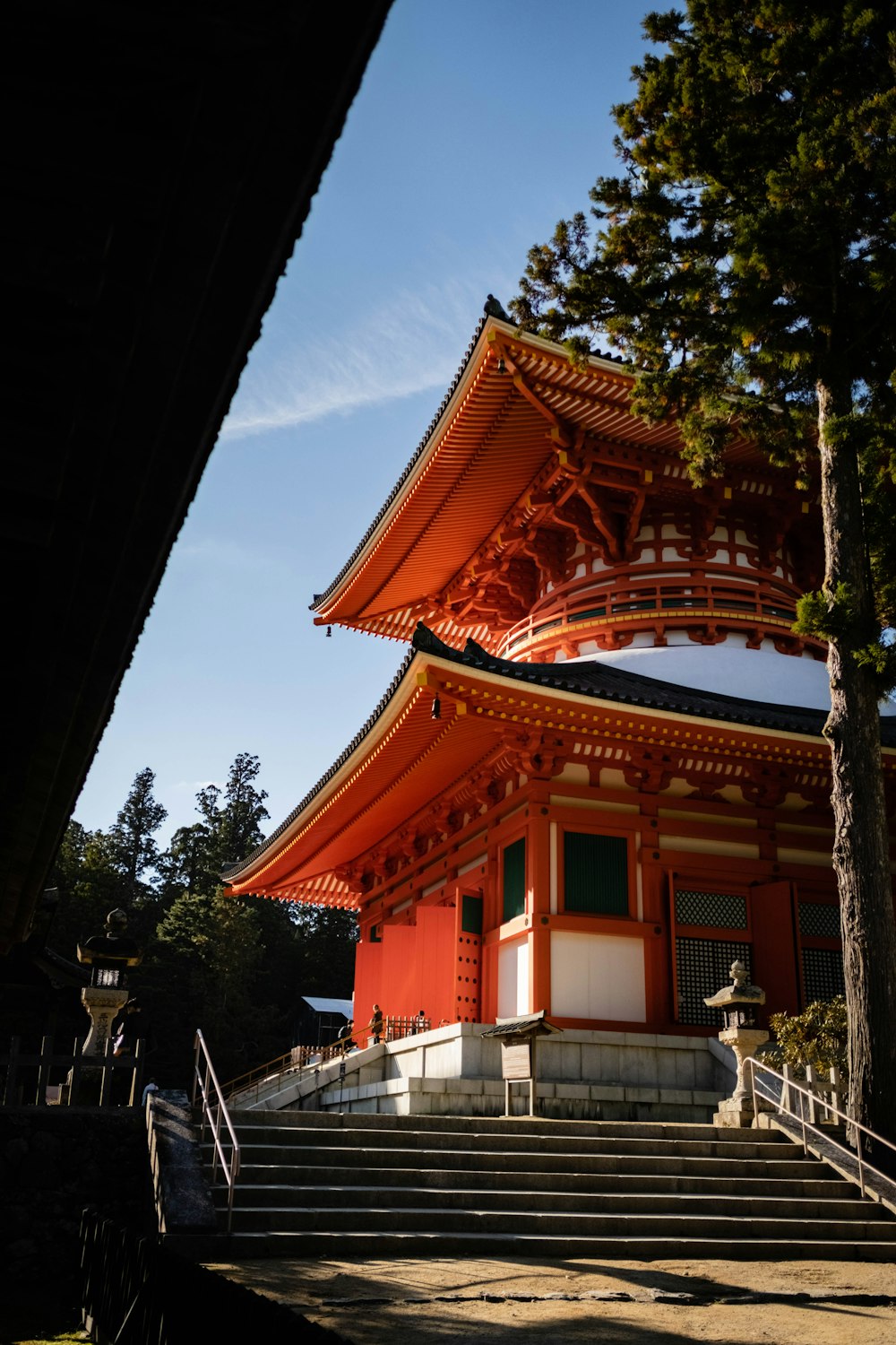 a tall red building with stairs leading up to it