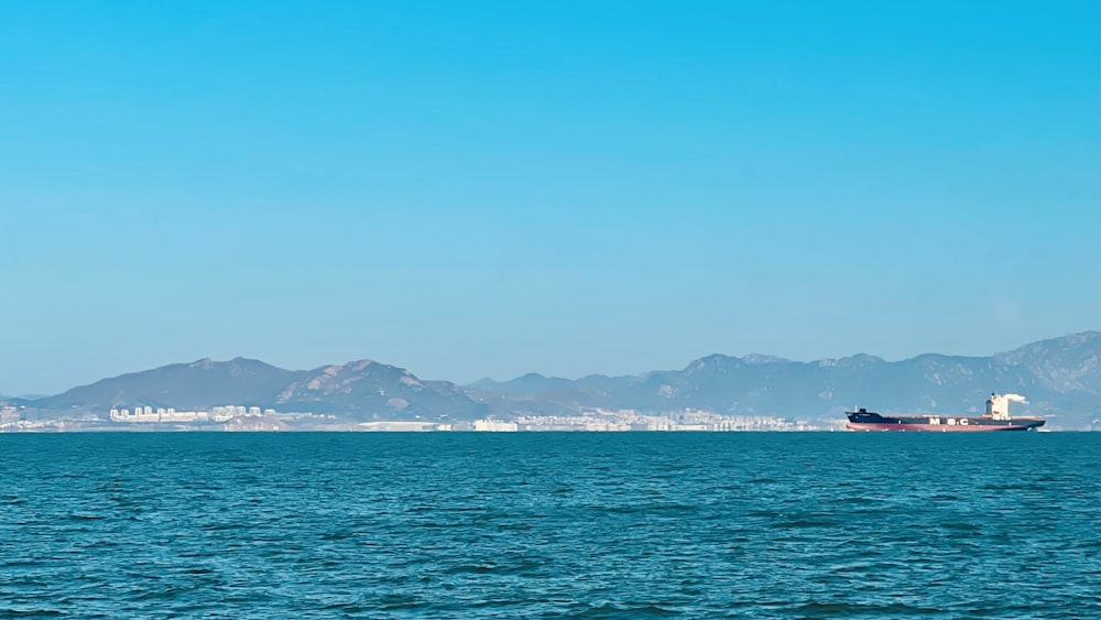 a large boat floating on top of a large body of water