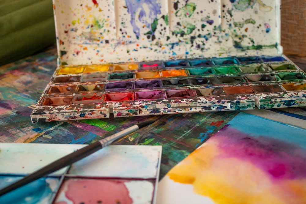 a palette of paint sitting on top of a table