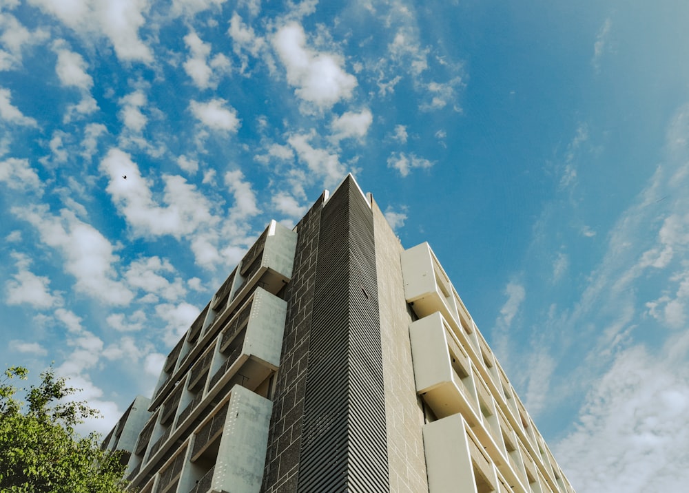 a very tall building with a sky background