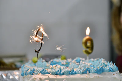 a birthday cake with a sparkler on top of it