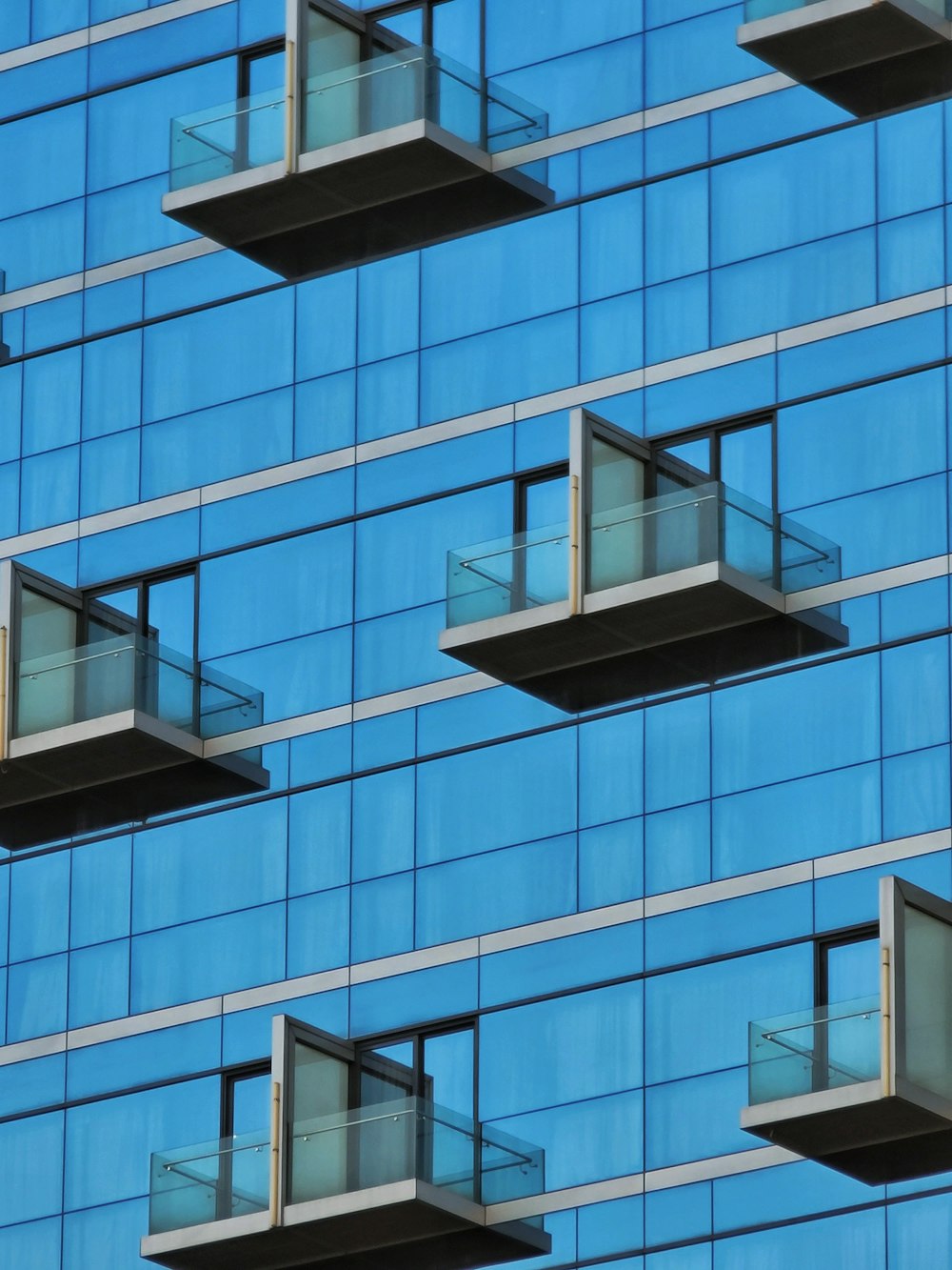 a very tall building with some balconies on it