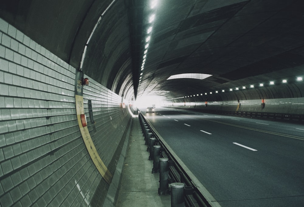 a tunnel that has a bunch of lights on it