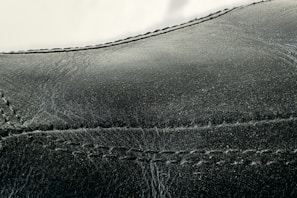 Luxury leather jacket showing repaired seams and renewed texture