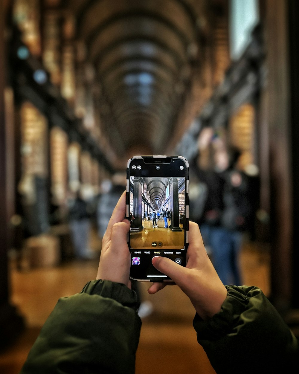 a person taking a picture with a cell phone