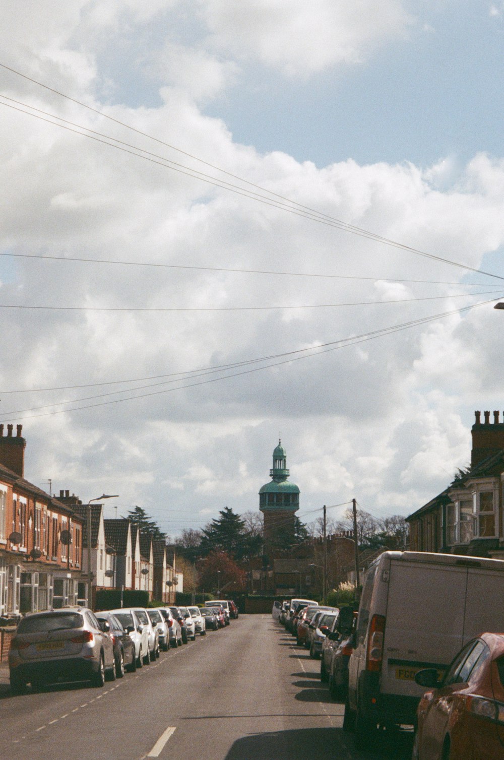 a street with cars parked on both sides of it