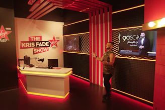 A cozy radio studio with a microphone and headphones ready for a live broadcast.