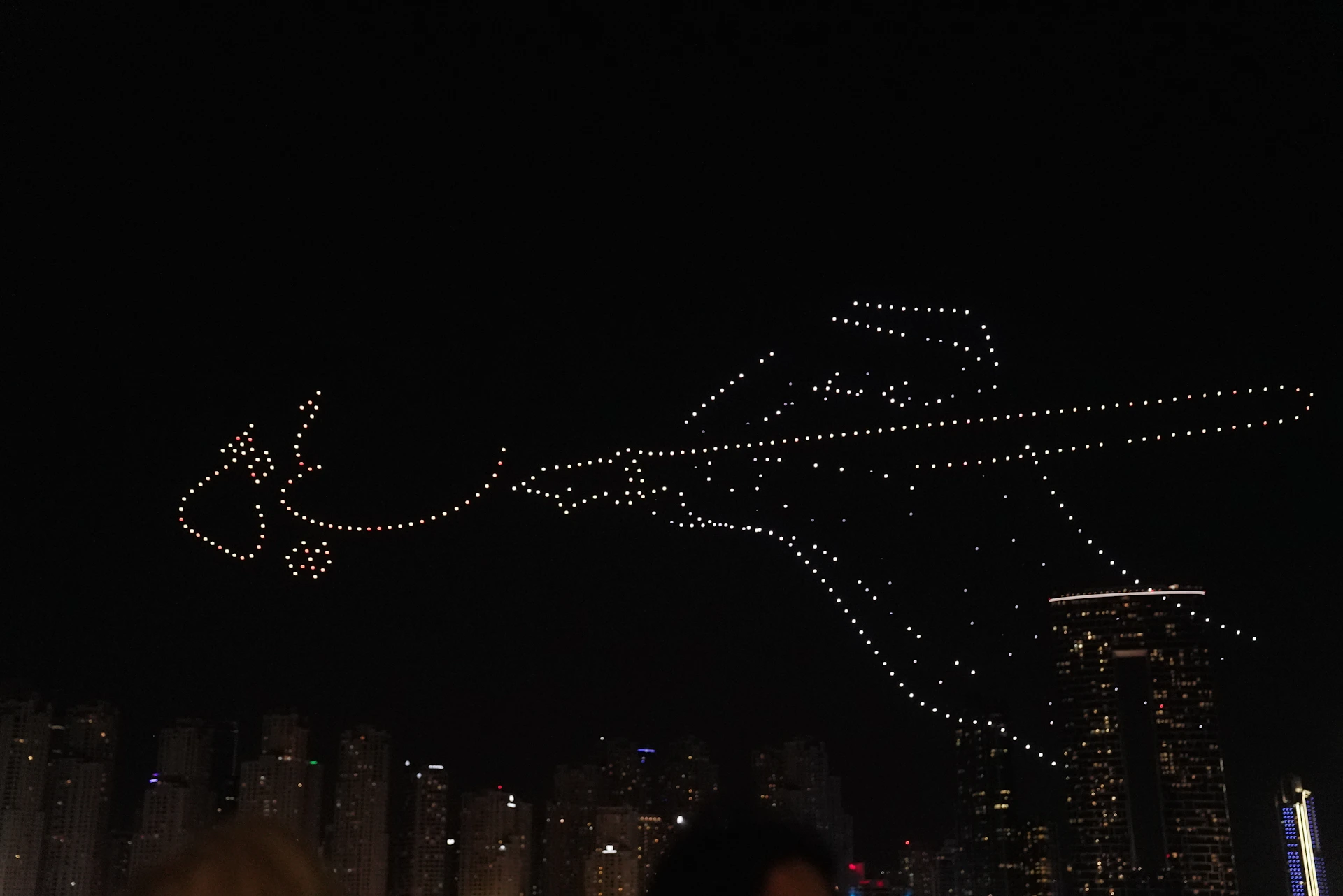 A cinematic scene with silhouettes of superheroes and fantasy creatures against a starry night sky, capturing the magic of movies and series.