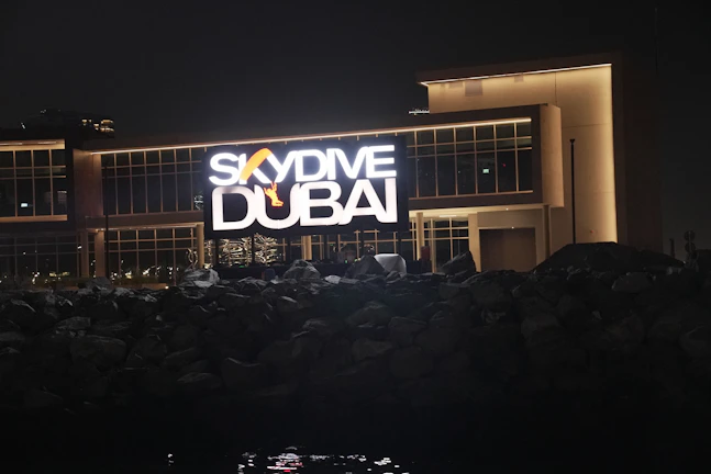 A vibrant 3D aluminium sign mounted on a storefront in Dubai.