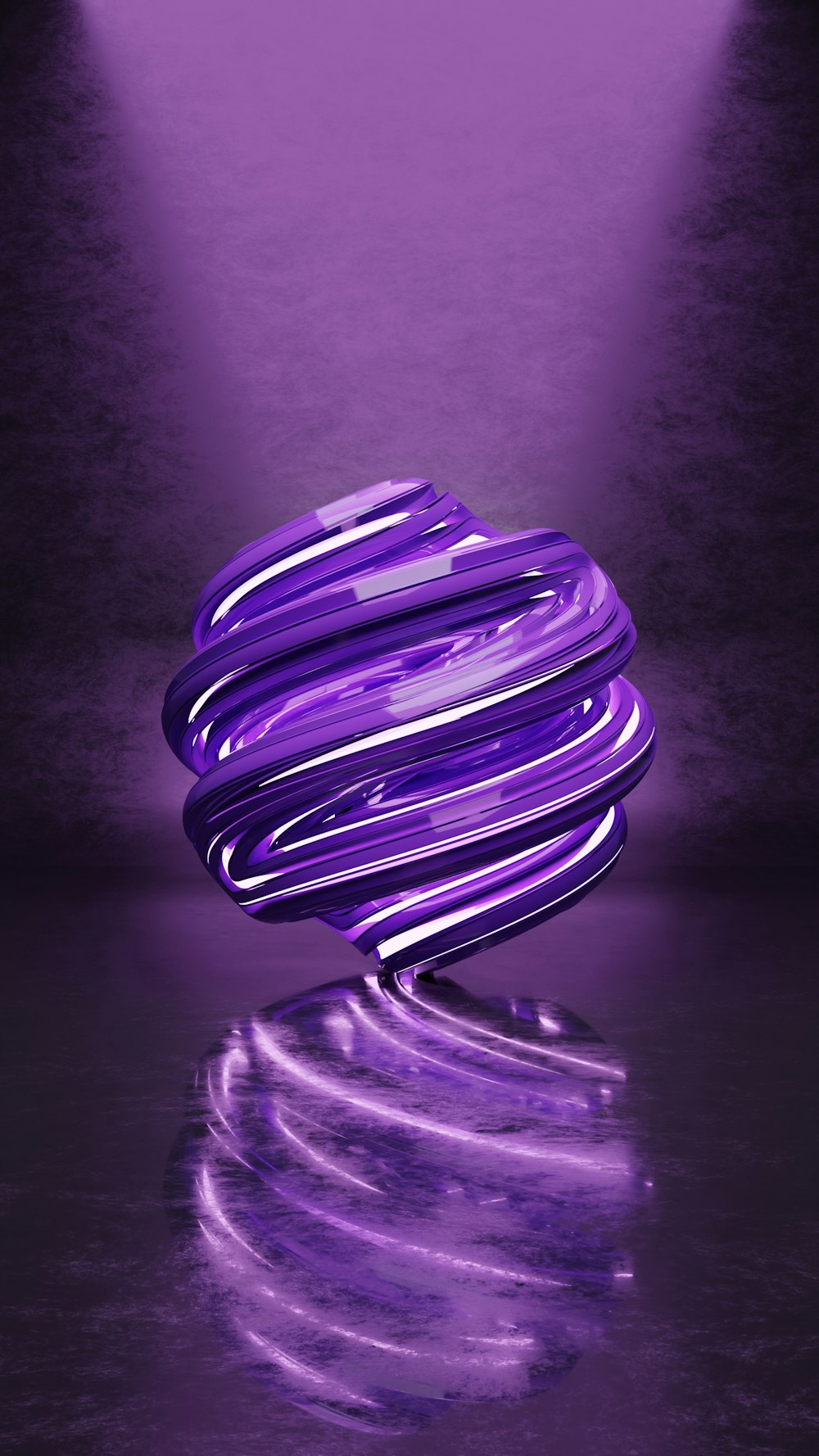 a purple object sitting on top of a reflective surface