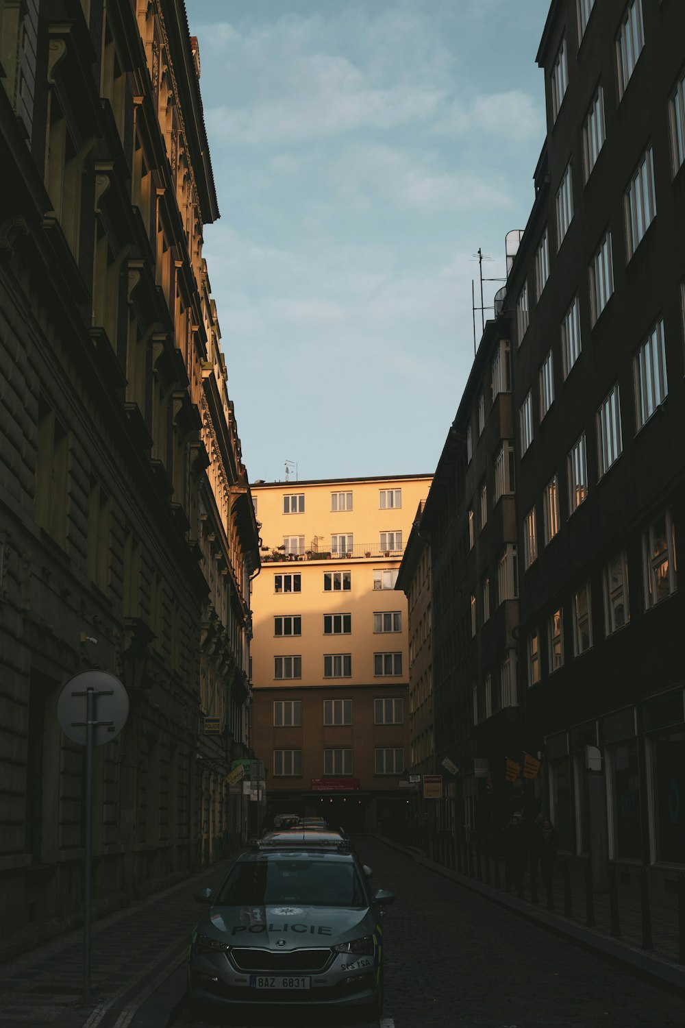 a car is parked on the side of a street