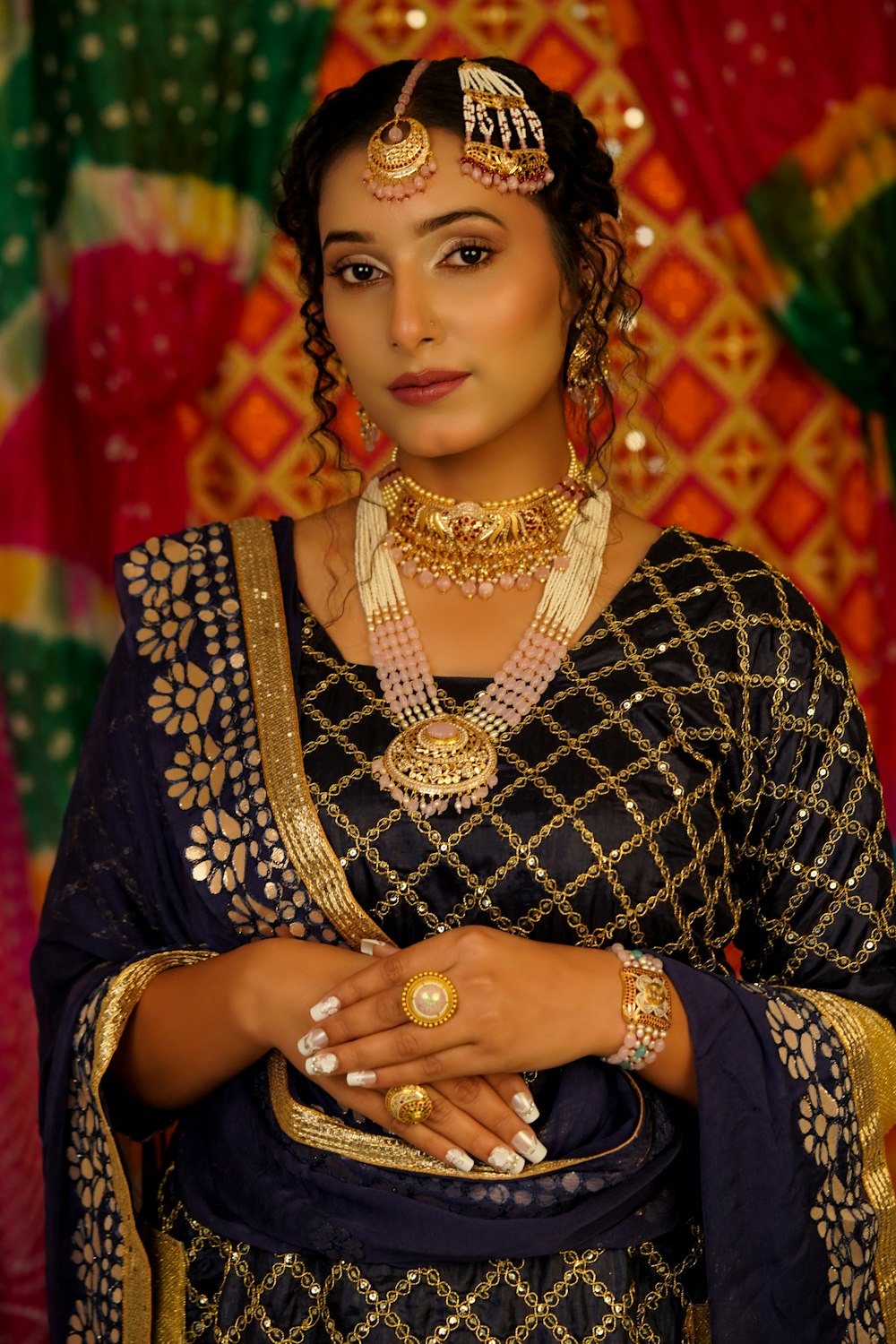 a woman in a black and gold outfit