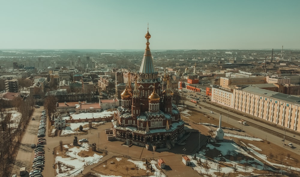 an aerial view of a church in a city