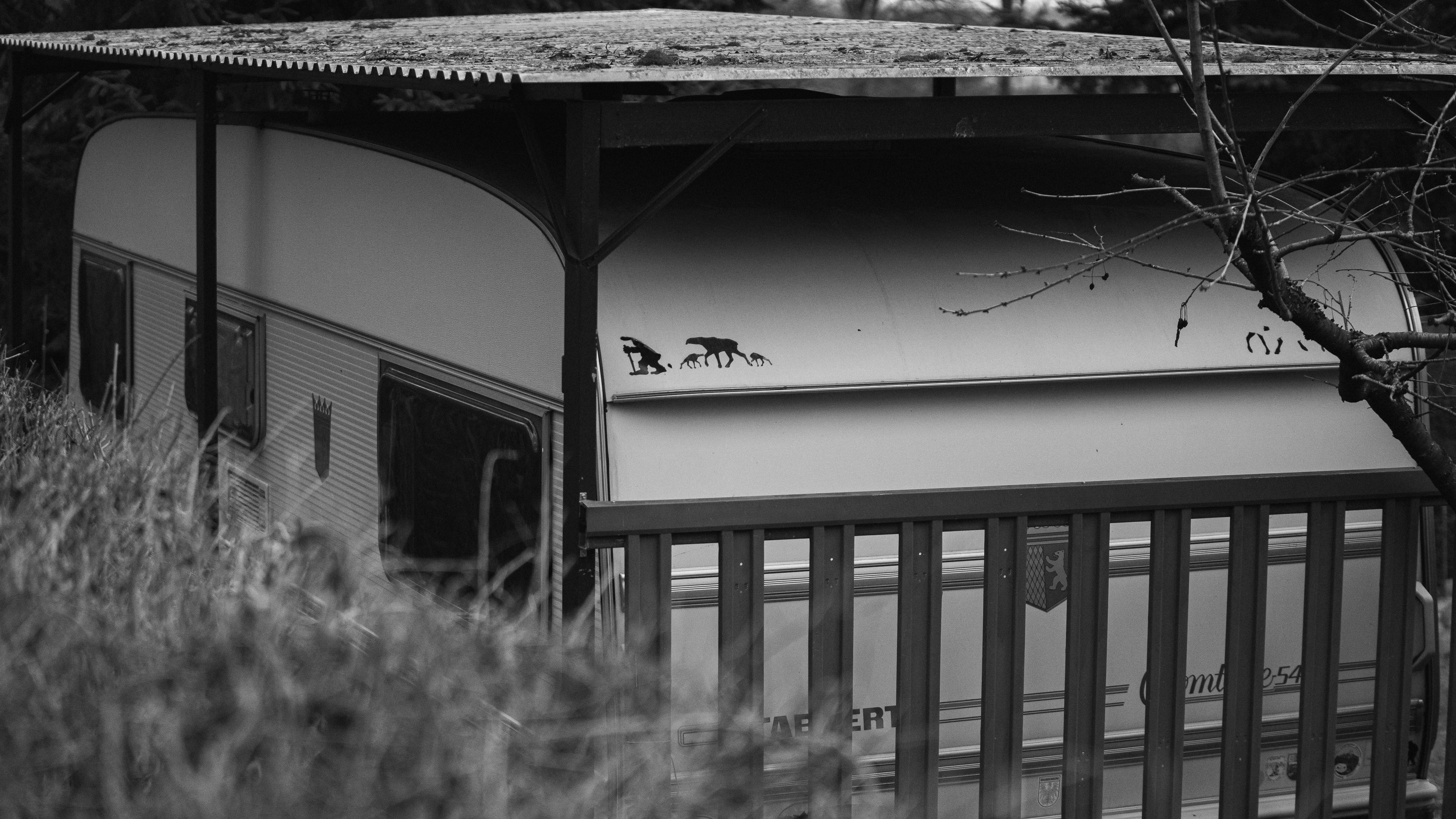 a black and white photo of a building with a roof