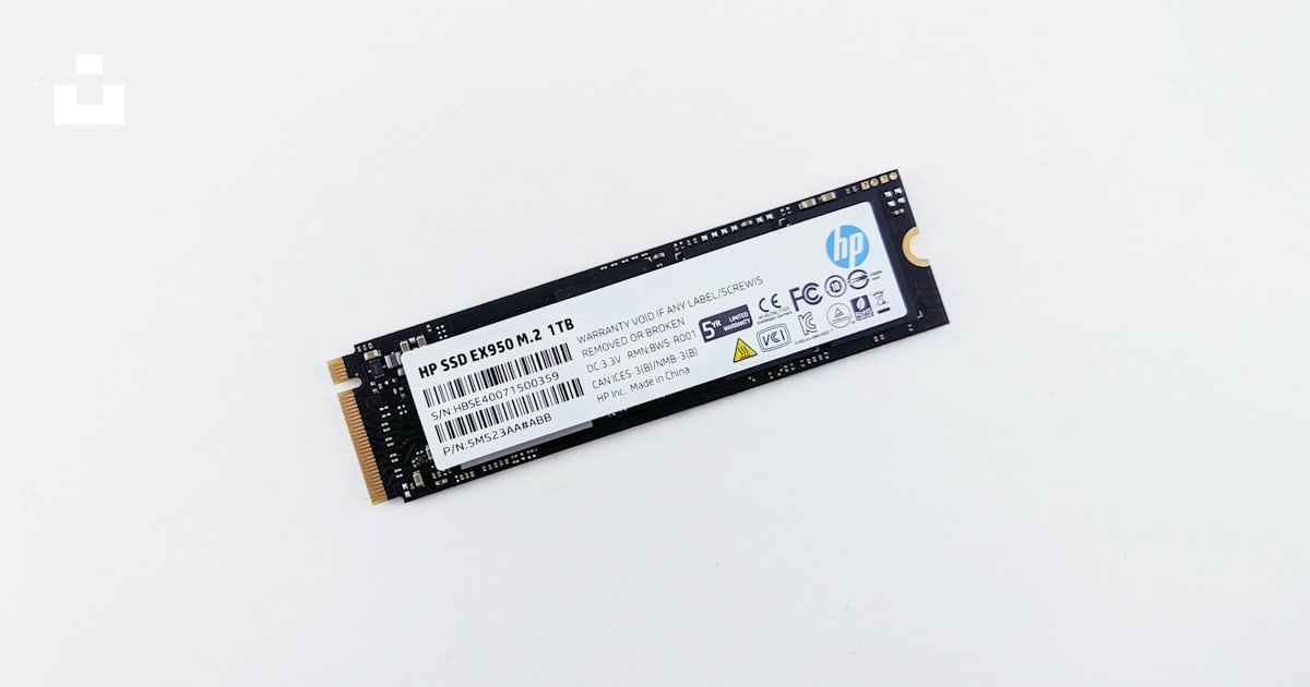 A close up of a memory card on a white surface photo – Free Hardware ...