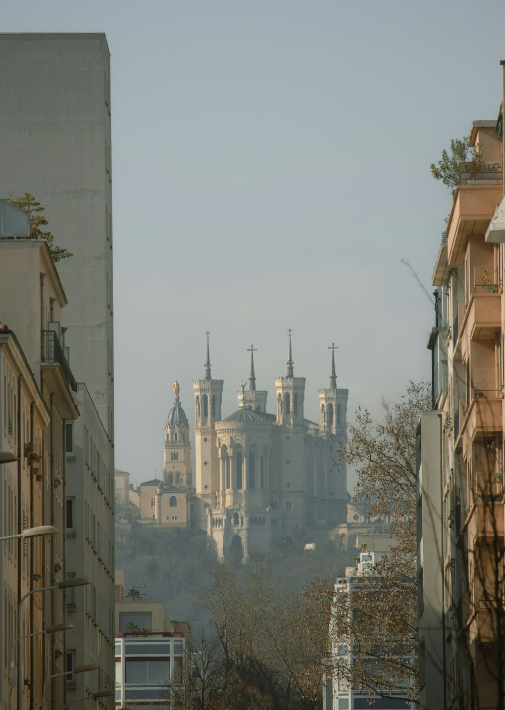 a city with a castle in the background