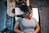 a woman getting her hair cut by a hair stylist