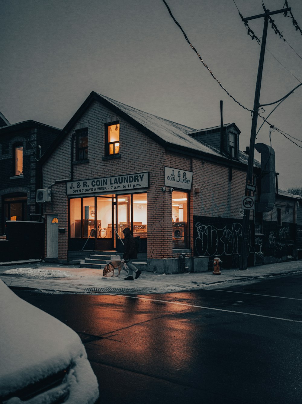 a small building sitting on the side of a road